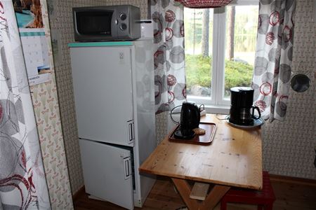 Room with a fridge.