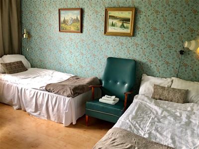 Room with two single beds.