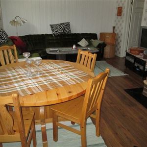 Round dinner table with four chairs.