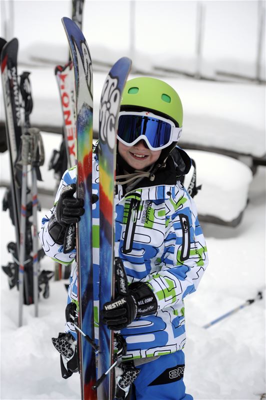 A child with ski's.