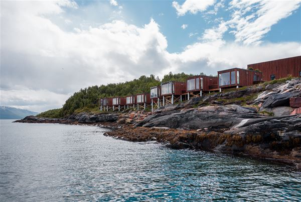  &copy; Lyngen Resort, view of many cabins on the water's edge 