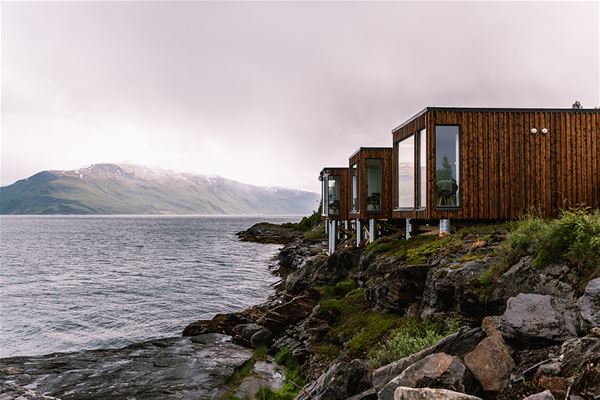  &copy; Lyngen Resort, cabins and large windows on the sea front 