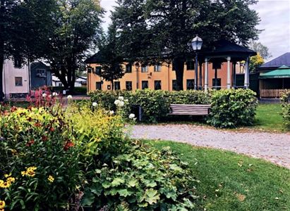 Exterior image, summer, plantings at the front of the image.