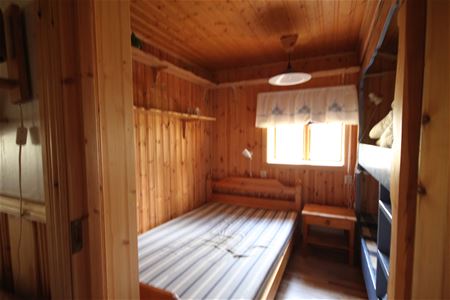 Bedroom with a single bed and a bunk bed.