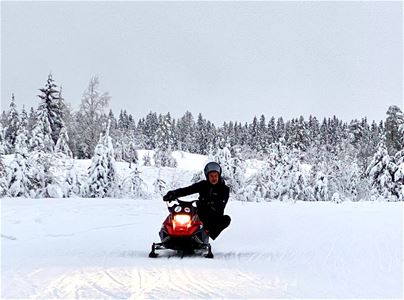 A person turns in a turn with a scooter.