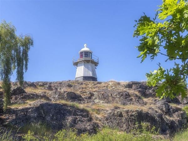 The wooden lighthouse on the island 