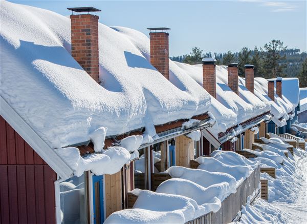 Cottages covered in snow. 