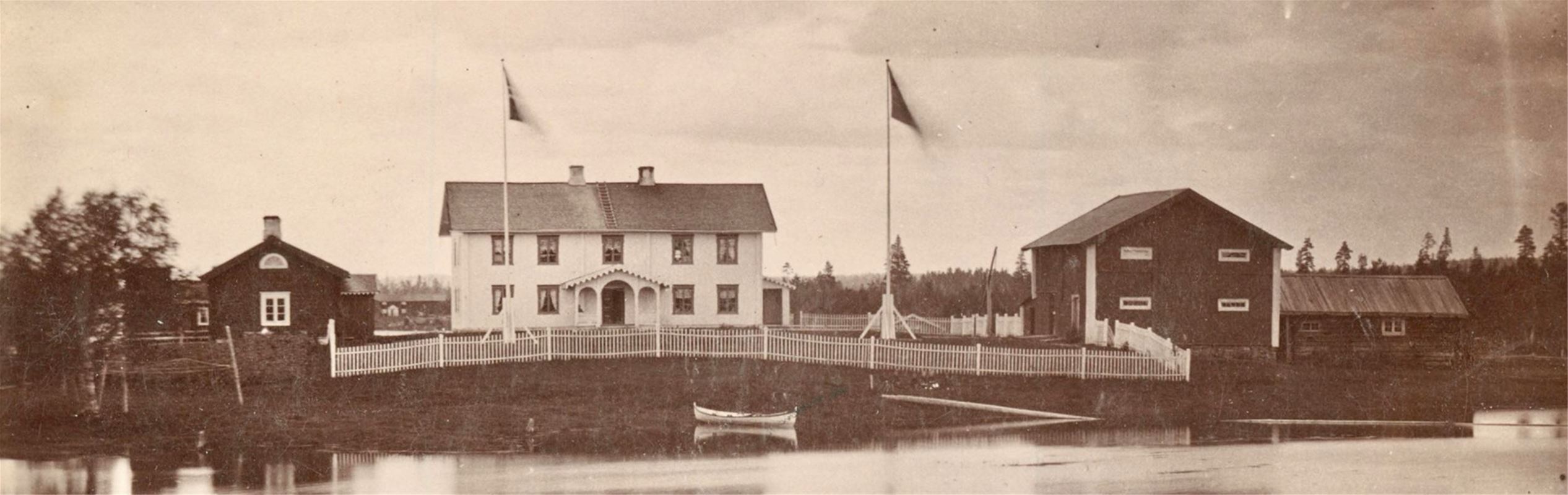 Old picture over the buildings and the river.