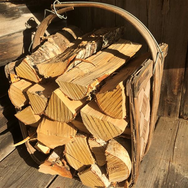 A basket with firewood. 