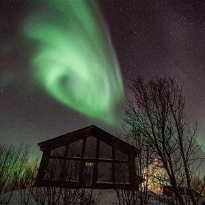  © Lyngen Resort, northern lights over cabin close-up
