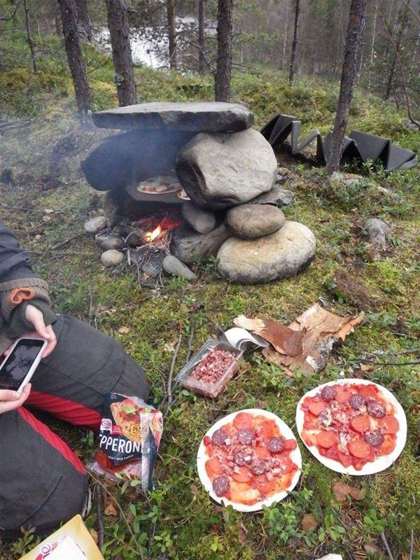 Two pizzas in the nature should be baked on the fire. 