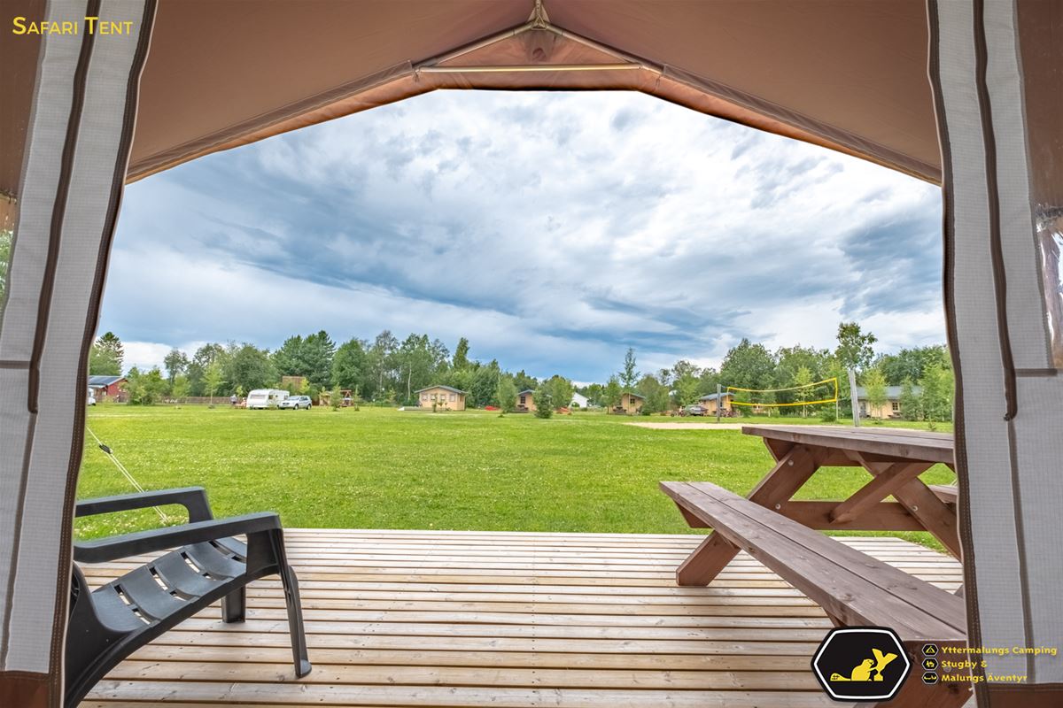 View over the campsite from inside a glamping tent. 