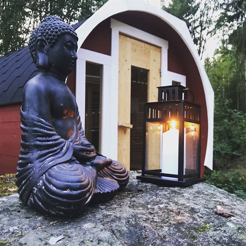 Sauna, buddha, candle lantern.