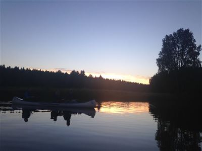 Canoe at dusk on the river.