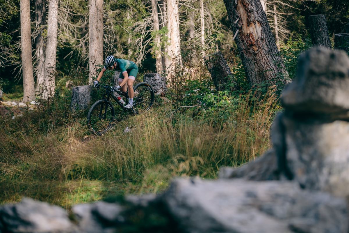 Man cycling in the forest on mountain bike.