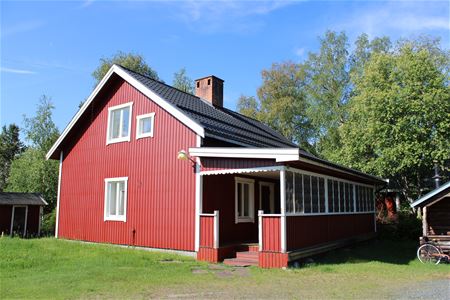 Exterior of a red painted house.