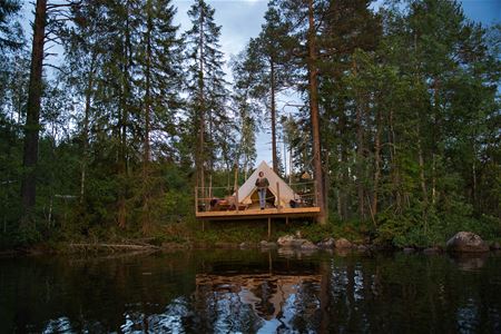 Glamping tent with a lake view.