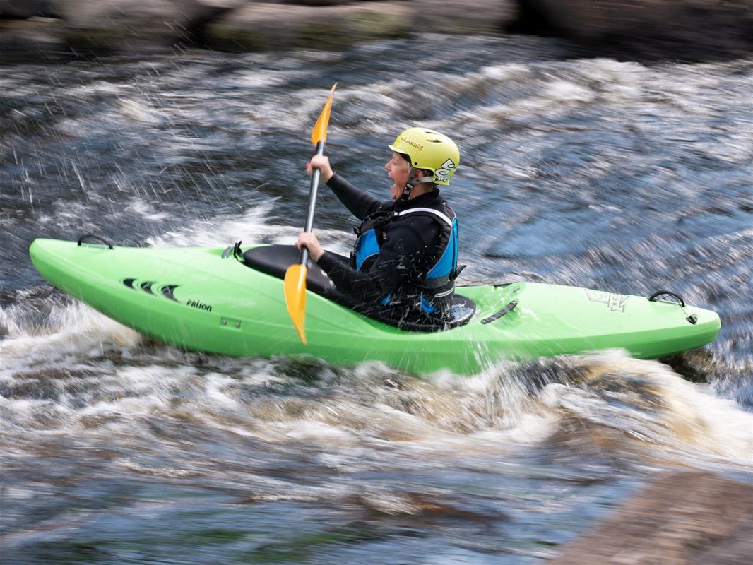 Kayak paddlers in the rapids.