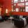 Lobby, red walls and black leather furniture.