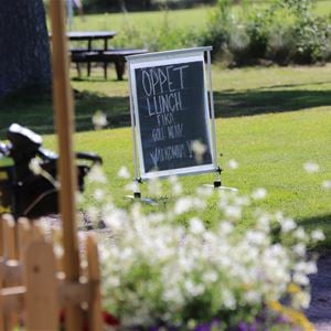 A lunch sign outside the golf restaurant.
