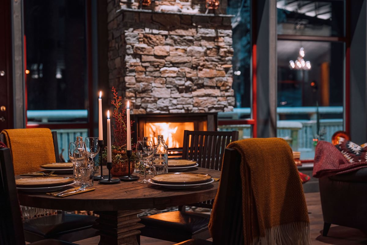 Inside the restaurant Renen & Älgen, a nice set table and a fire place