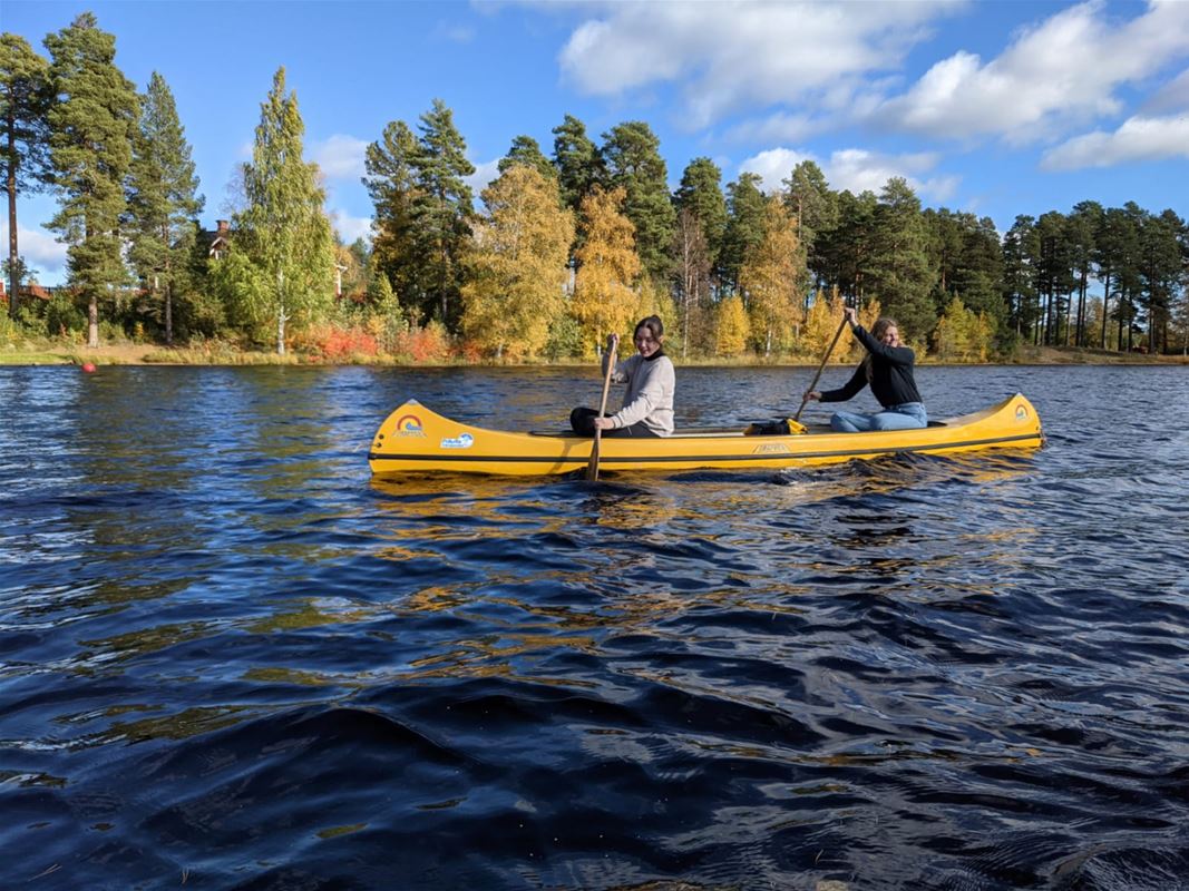 A couple on a canoe.
