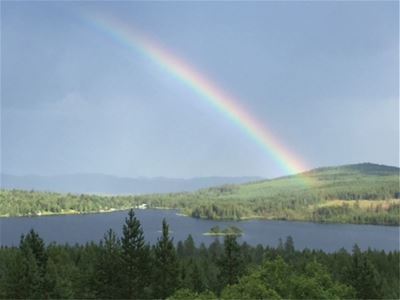 Rainbow over a lake.