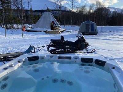 24 hr Experience the arctic by spending a night in a Aurora Hut and enjoying a snowmobile safari