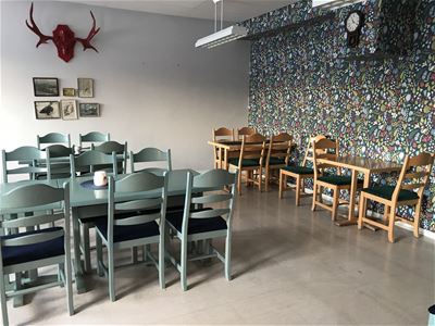 Dining room with elk horn on the wall. 