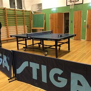 Ping pong table in a gymnastic hall. 