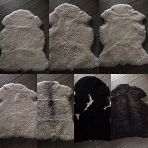 Färgbild - collage v små bilder på fårskinn i olika nyanser av vitt, svart och grått