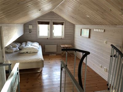 A loft with a double bed.
