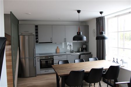 A kitchen with a dining area.