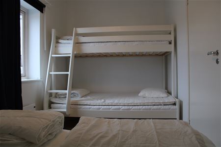 Bedroom with a double bed and a bunk bed..