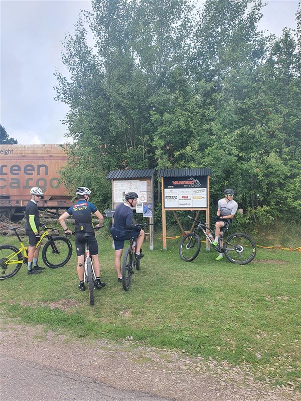 Gathering of MTB riders ready for the start of a trail ride.