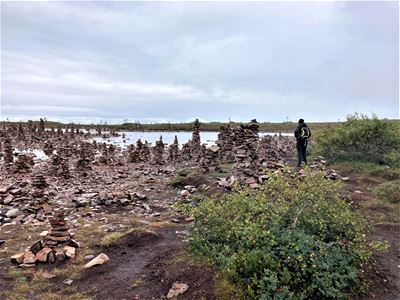Lots of stacked stones around the lake.