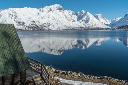 winter landscapes reflected in the fjord