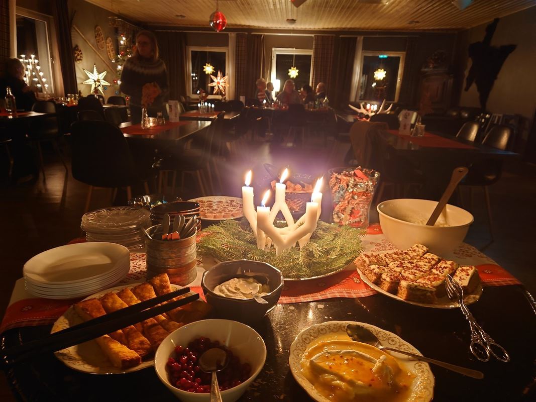 A buffet with candles in the middle. 