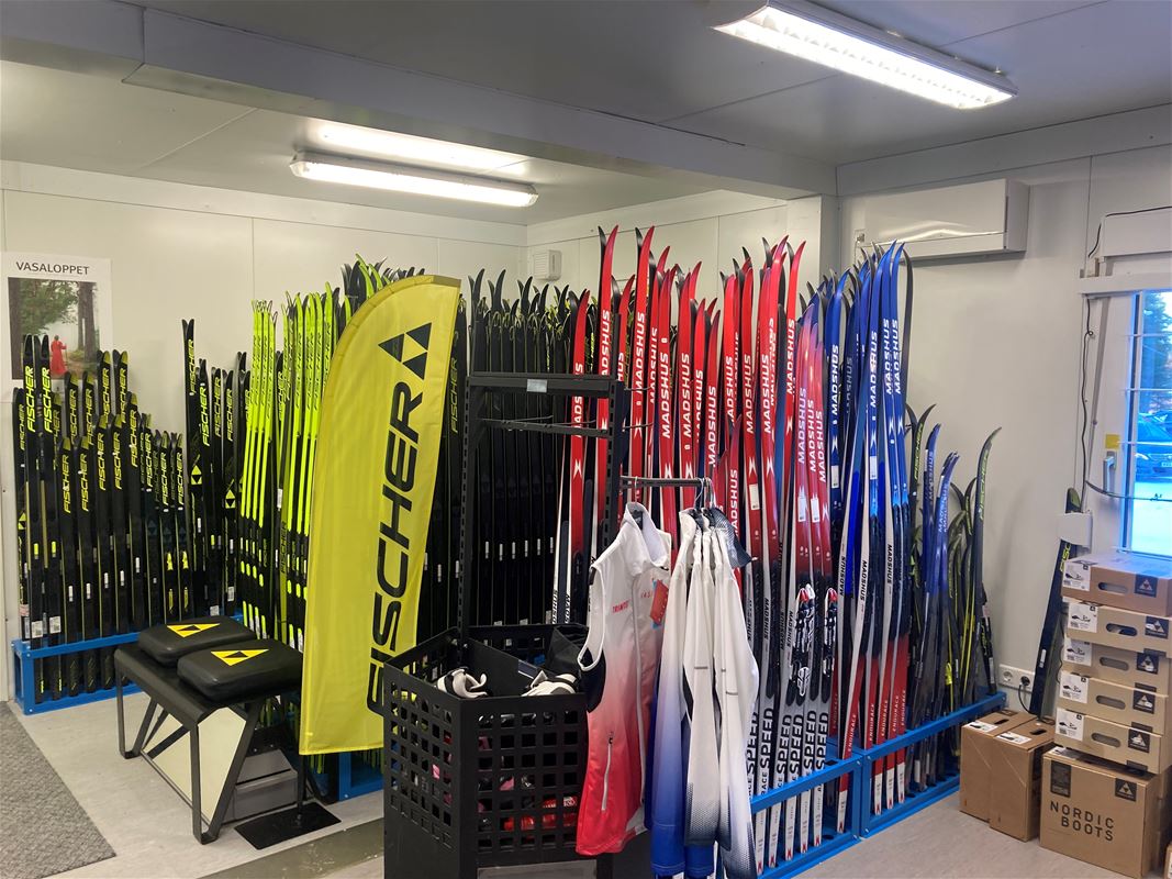 Interior image with skis lined up in racks.