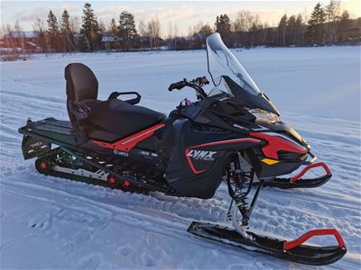 A red and black snowmobile.