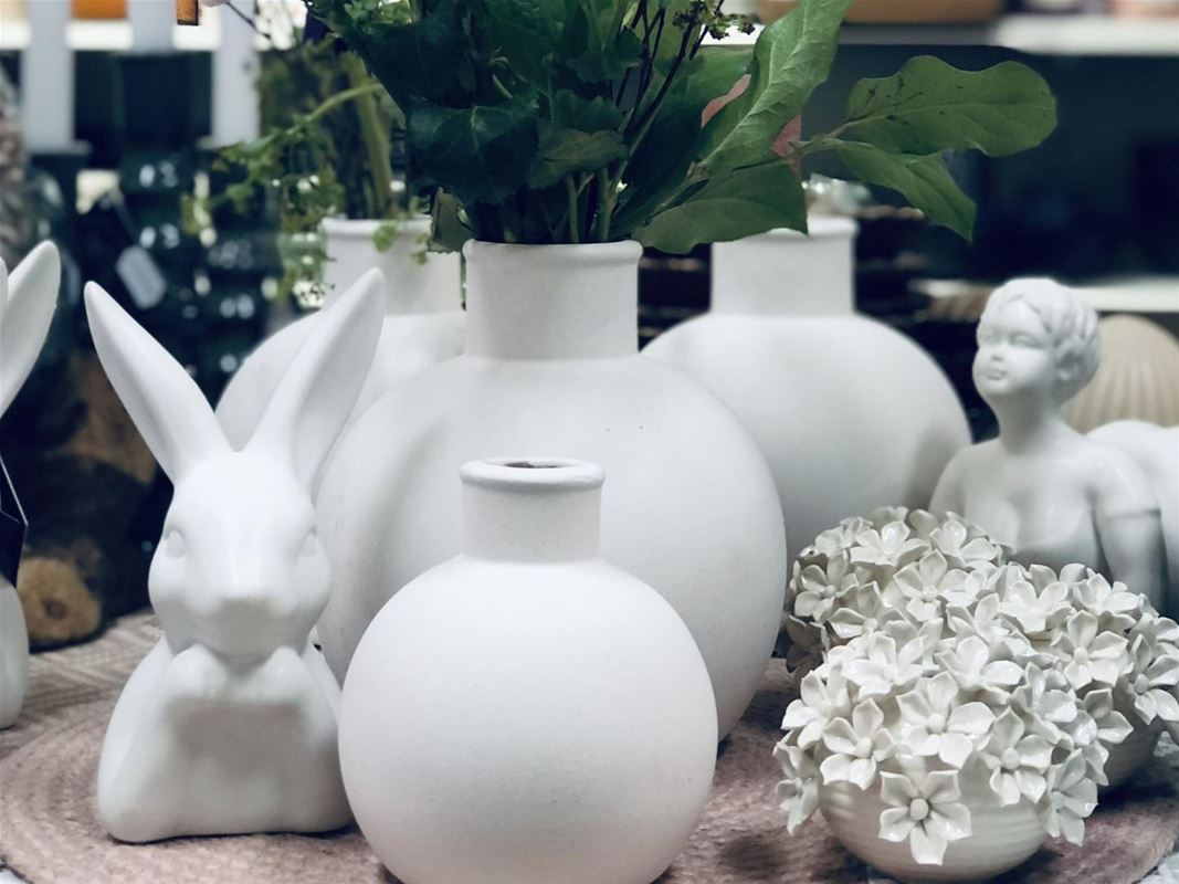 White vases on a table.