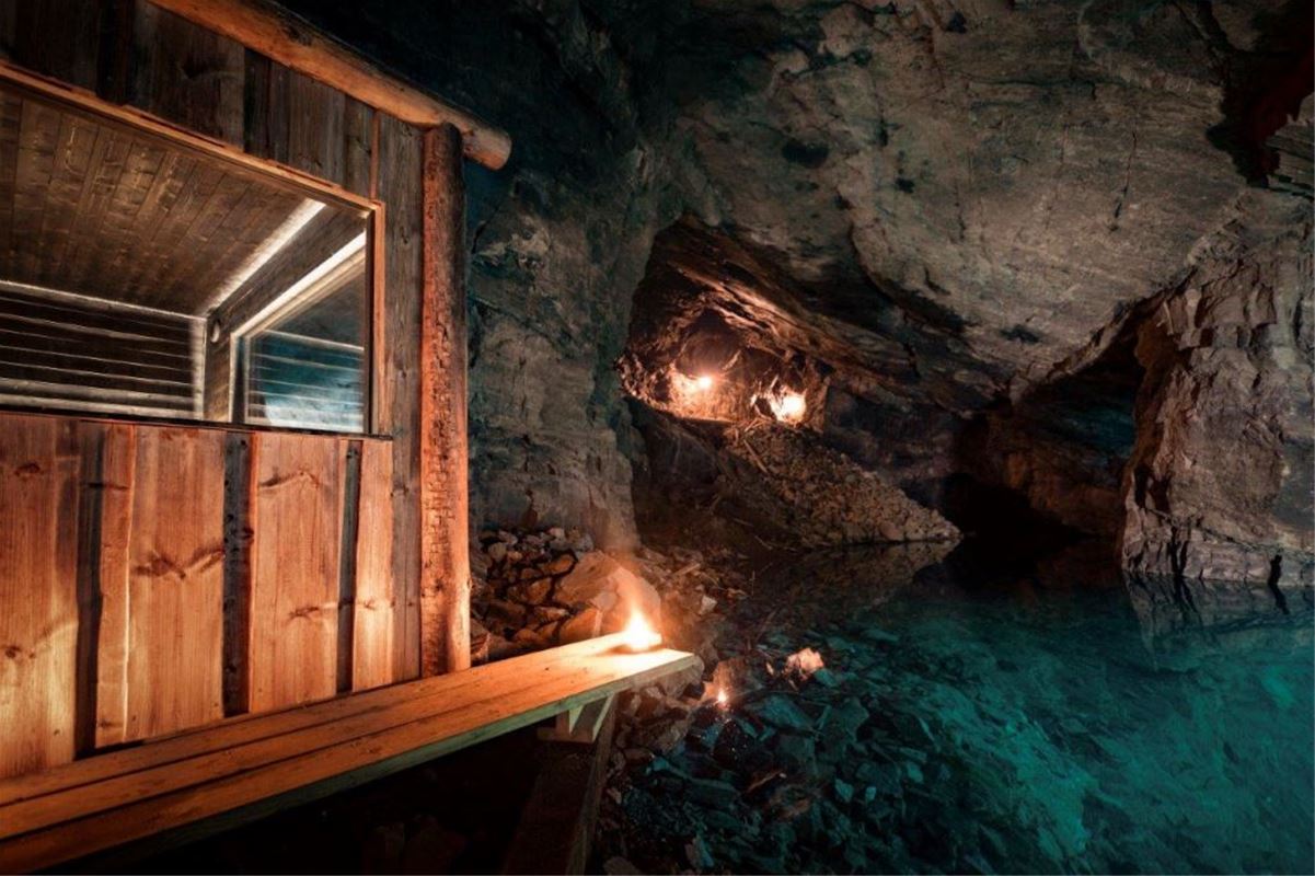 A sauna in  a mine, green water.