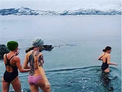 Friends ice bathing