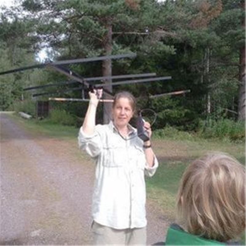 Lady holding an antenna.
