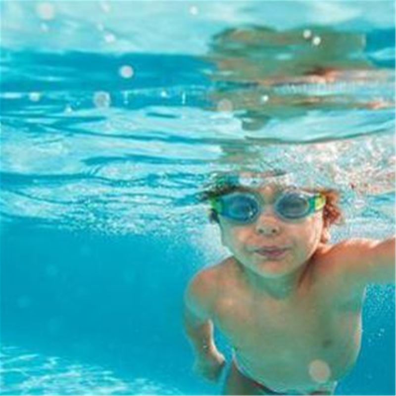 Boy swimming under the water.