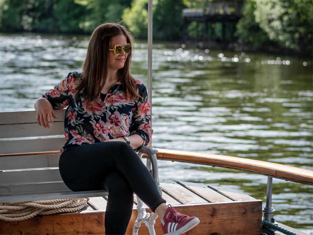 Woman sitting on boat.