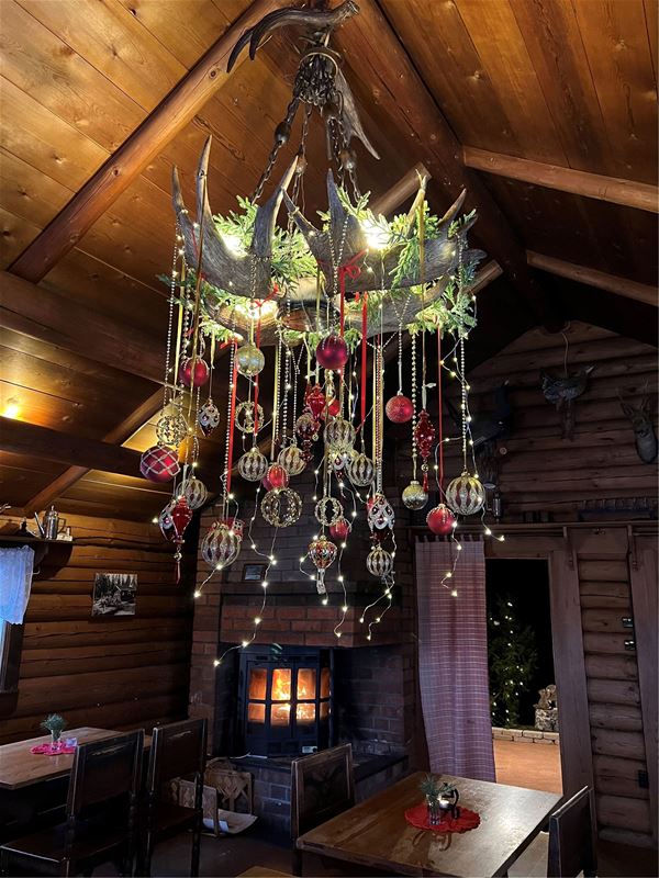 Christmas ornaments in a log cabin.