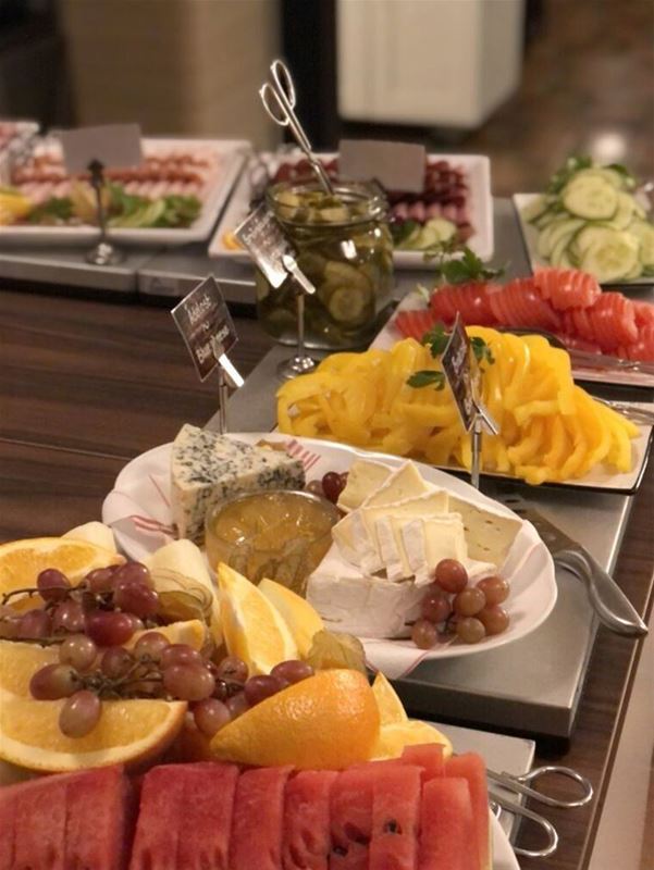 Fruit, cheese and vegetables on platter.