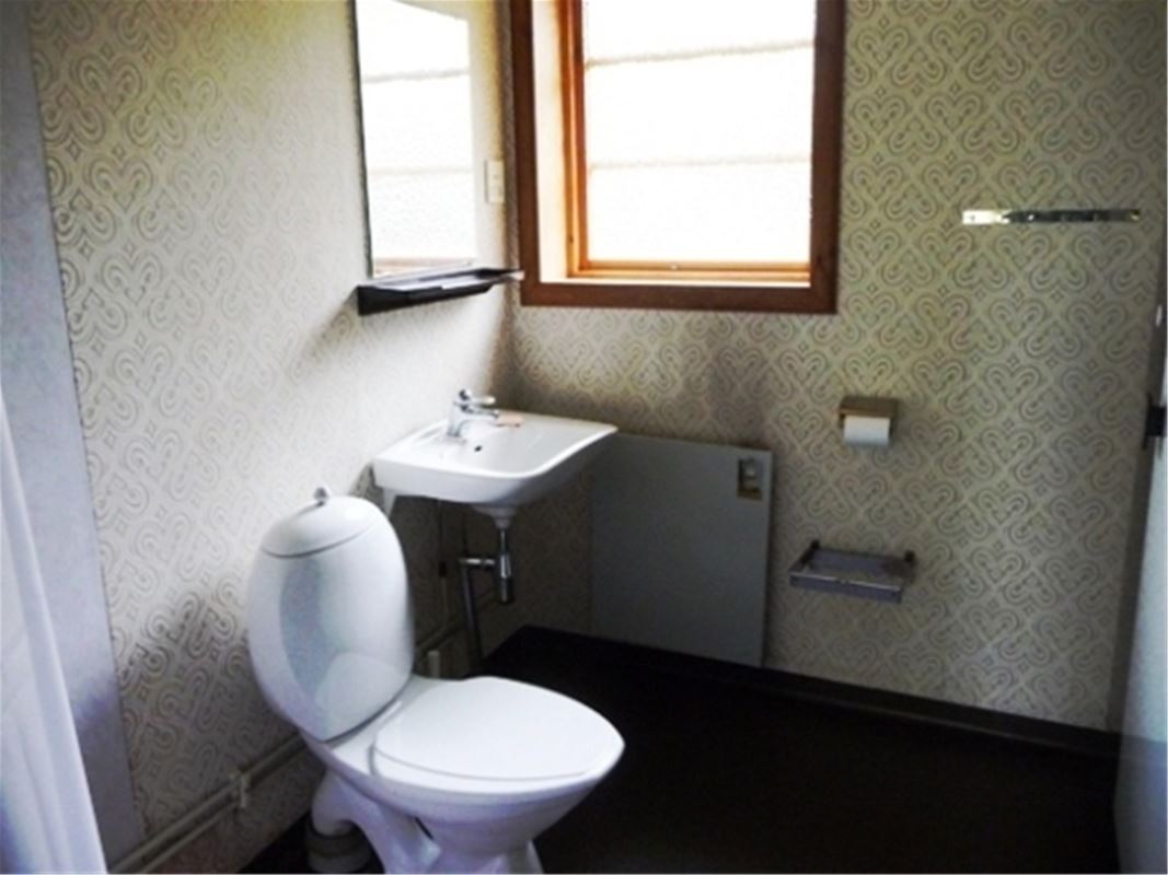 Bathroom with a toilet.