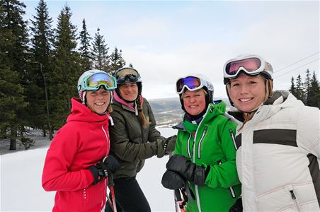 Four happy girls on the slopes.